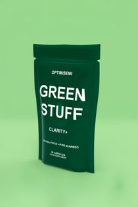 Green supplement package labeled 'Green Stuff' on a green background
