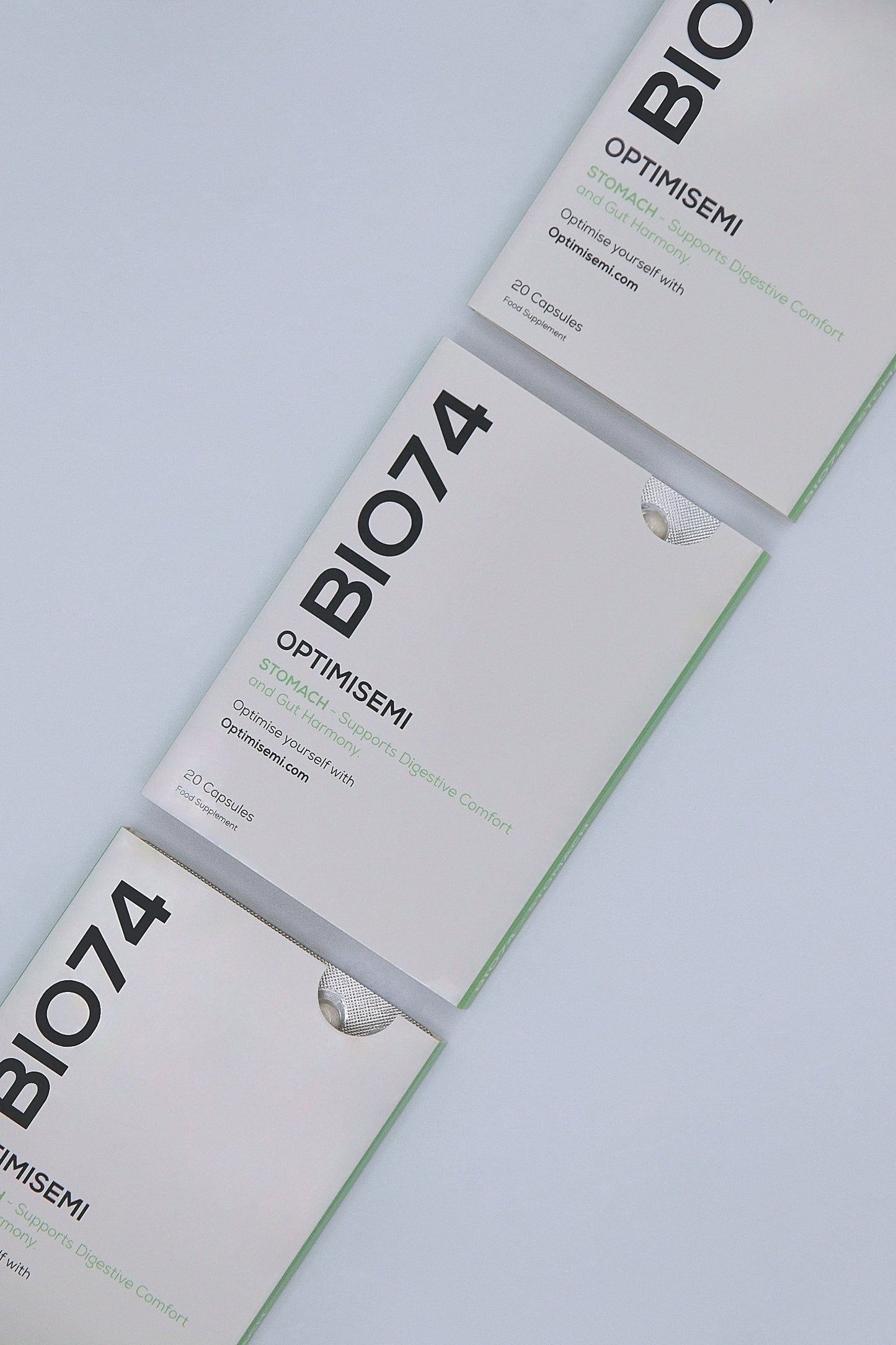 Image showing three BIO74 Stomach supplement boxes arranged diagonally at a 45 degree angle from top to bottom. Each box reads: STOMACH - Supports Digestive Comfort and Gut Harmony. Contains 20 supplement capsules. Supplement.