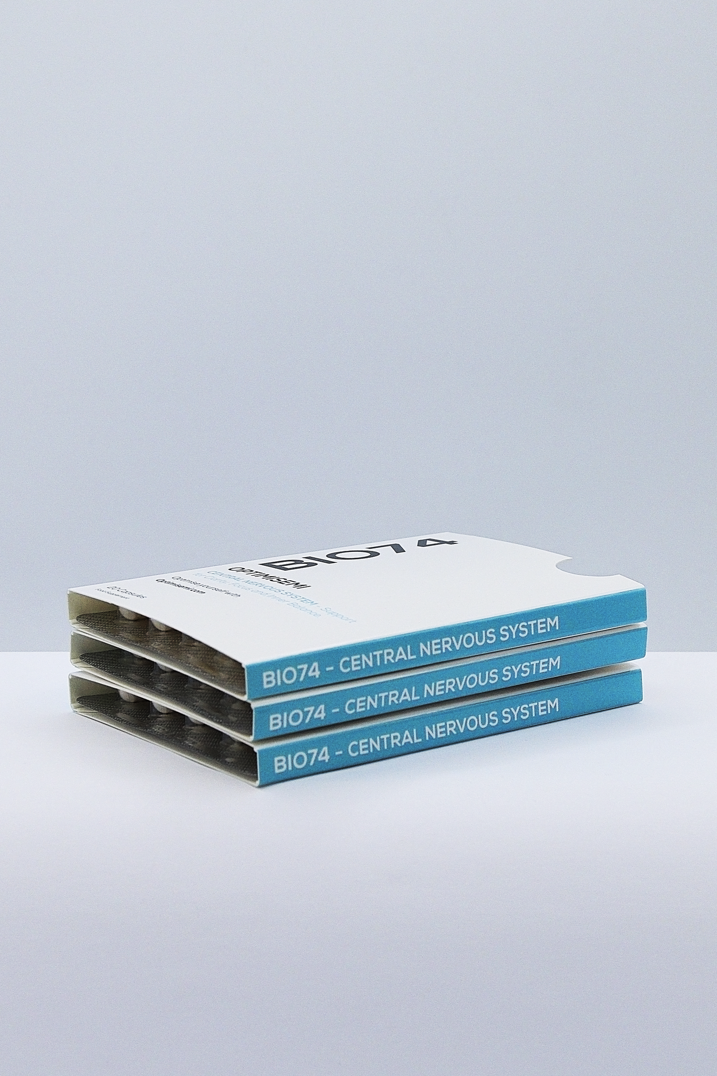 Image shows three cleanly designed boxes labeled BIO74 – CENTRAL NERVOUS SYSTEM, partially open to reveal tablet blister packs. The packaging suggests a health product focused on supporting brain or nervous system function, presented in a professional and clinical style.